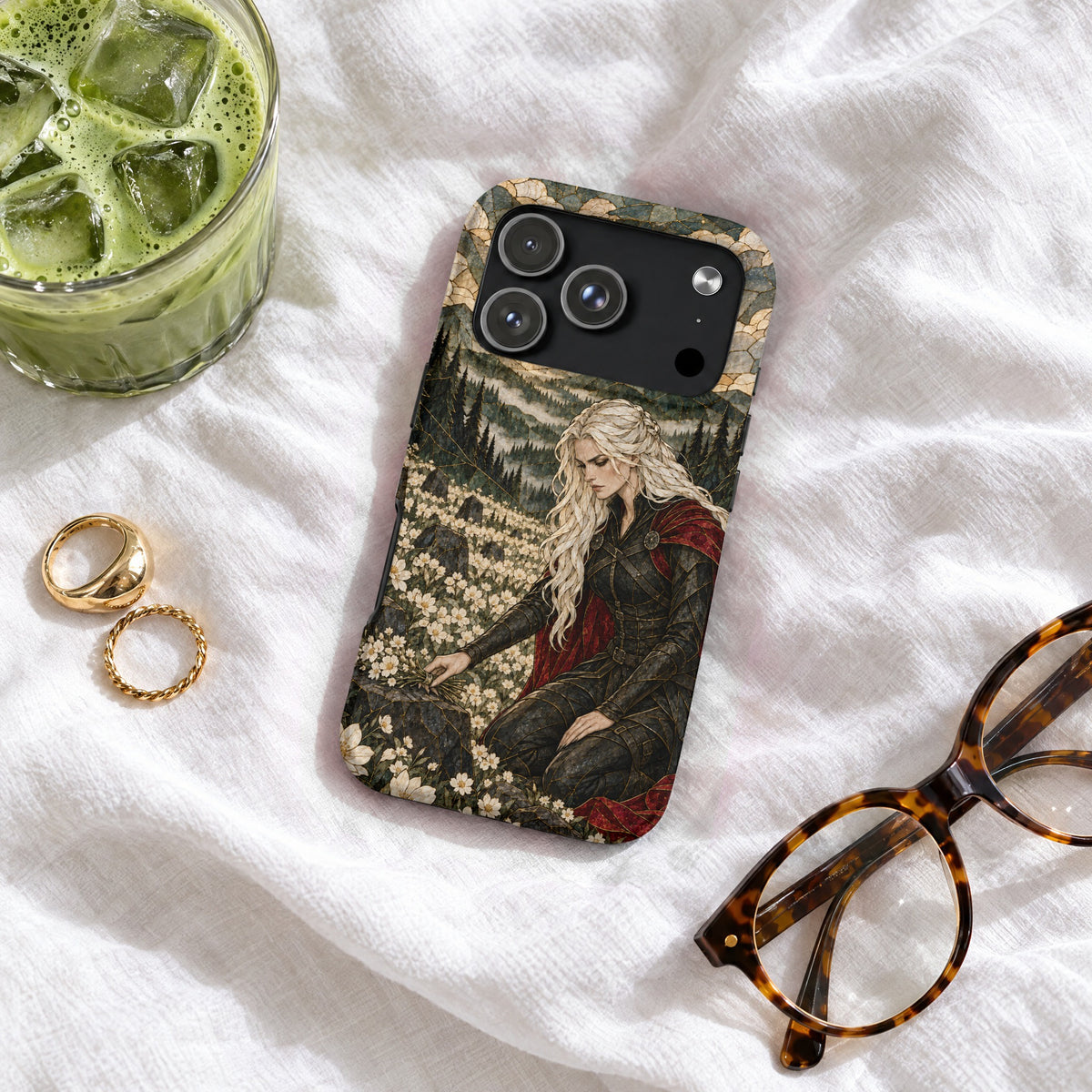 A phone case featuring a fantasy warrior woman kneeling in a field of white flowers.