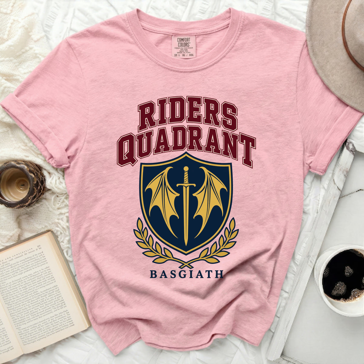 Pink t-shirt with "Riders Quadrant Basgiath" and a shield logo.