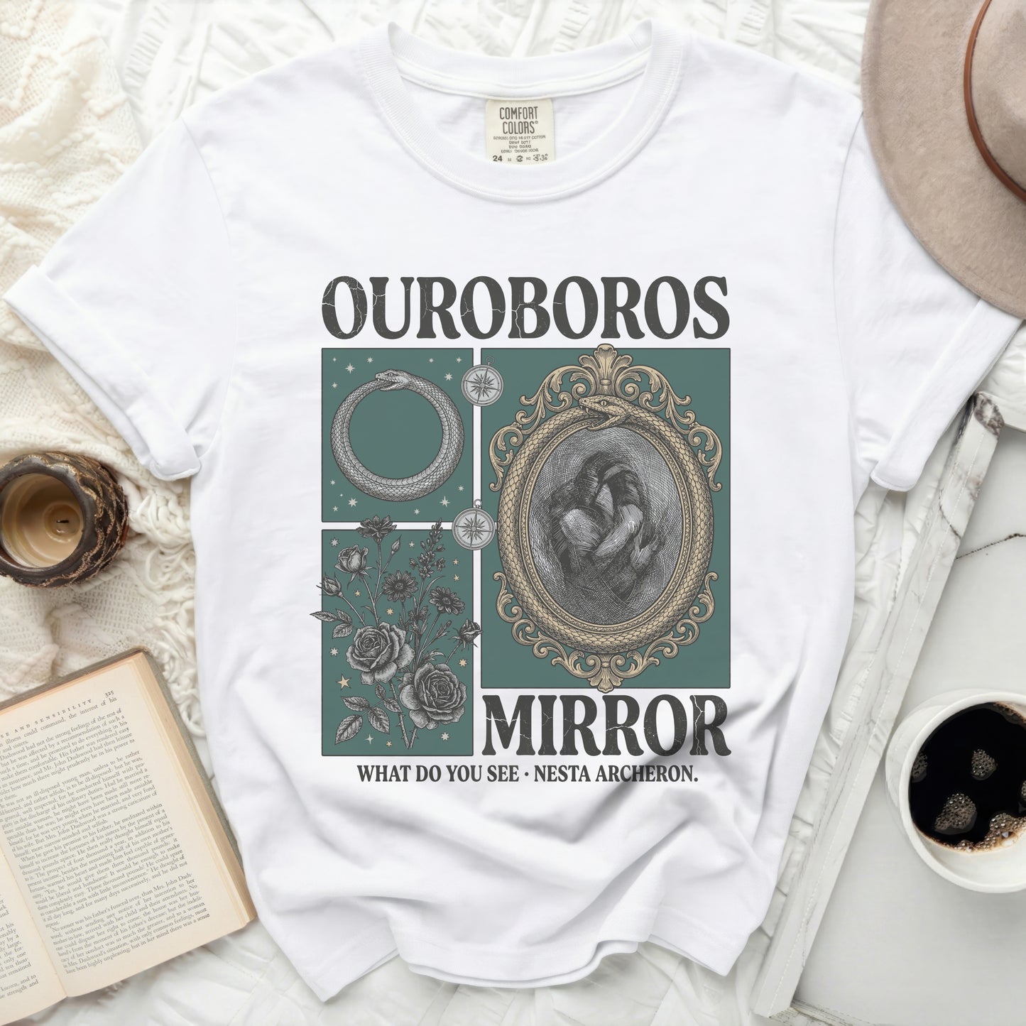 White t-shirt with "OUROBOROS MIRROR WHAT DO YOU SEE NESTA ARCHERON." graphic.