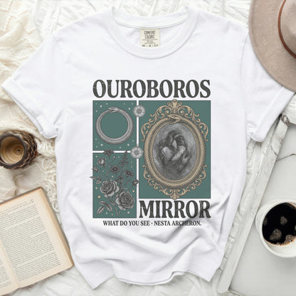 White t-shirt with "OUROBOROS MIRROR WHAT DO YOU SEE NESTA ARCHERON." graphic.