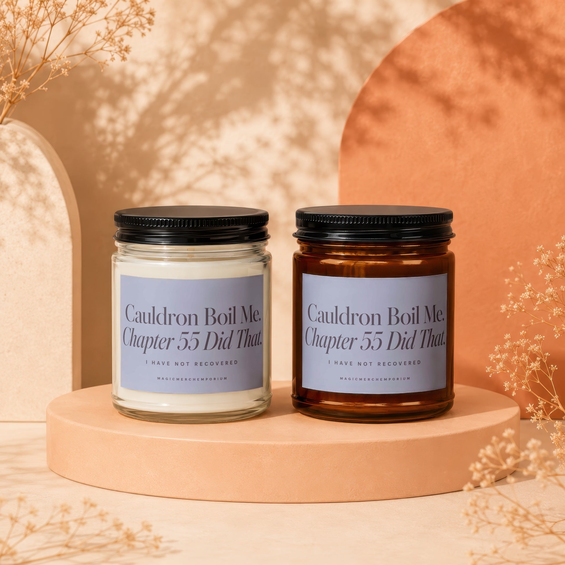 Two candles with labels reading "Cauldron Boil Me. Chapter 55 Did That."