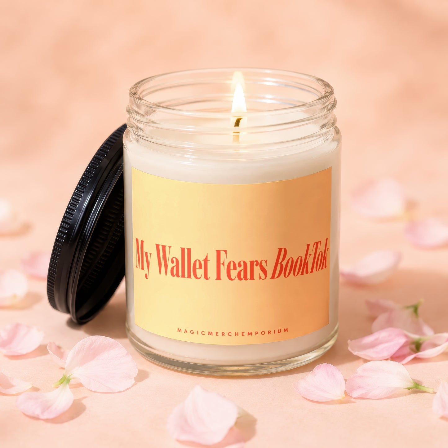 Glass jar candle with lit wick and text "My Wallet Fears BookTok".