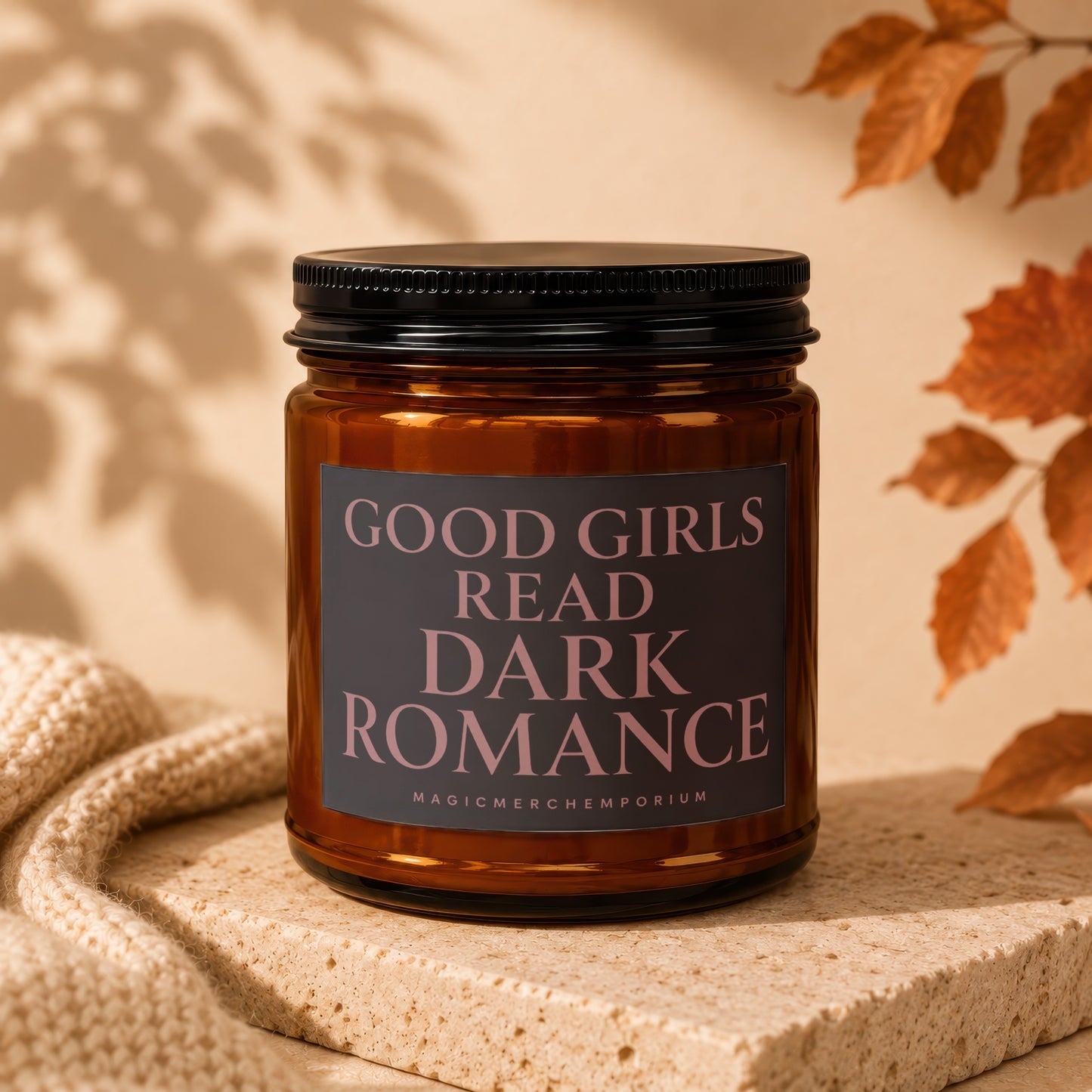 Amber candle with "GOOD GIRLS READ DARK ROMANCE" text on label.