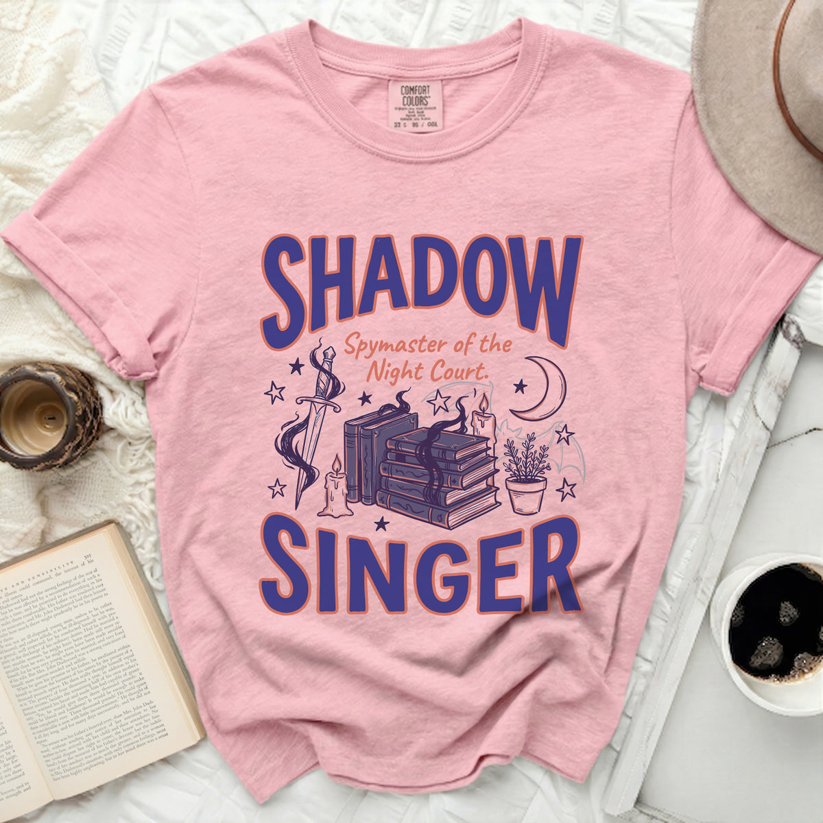 Pink t-shirt with "SHADOW Spymaster of the Night Court. SINGER" text.