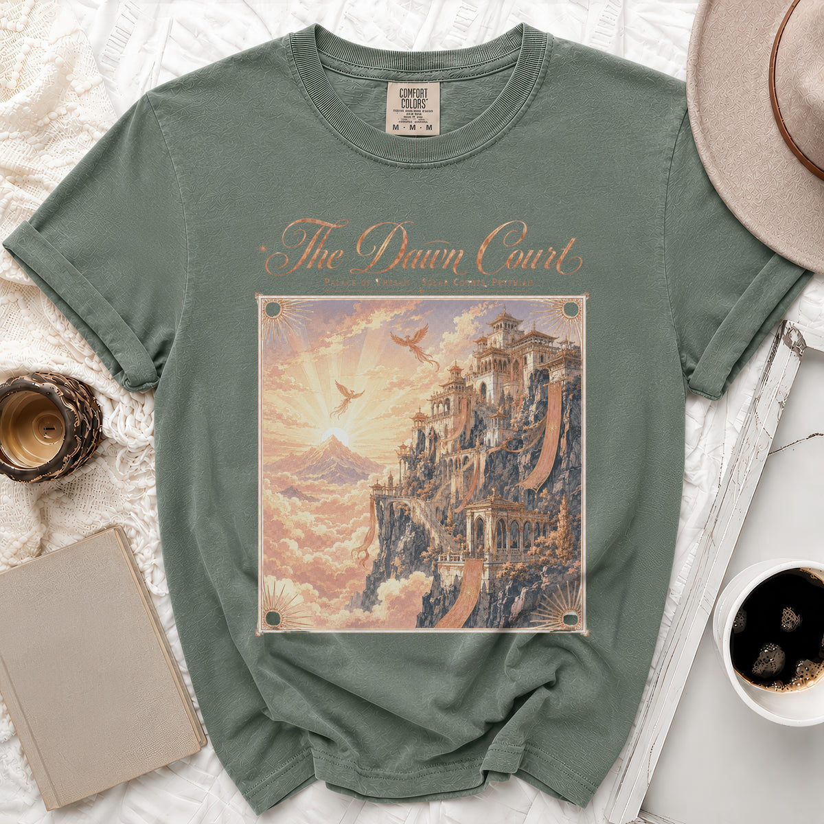 Green t-shirt with "The Dawn Court" text and fantasy castle graphic.