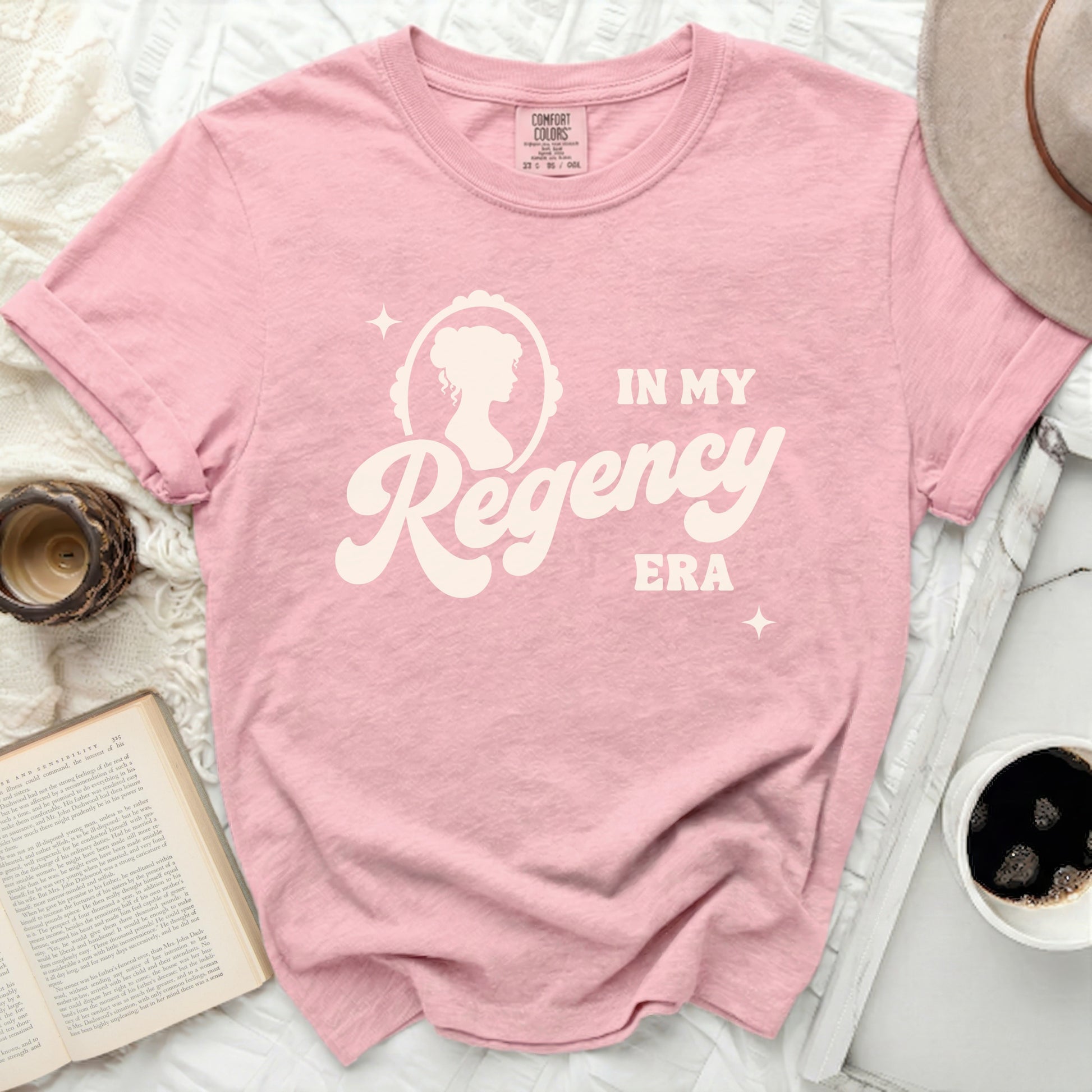 Pink t-shirt with "In My Regency Era" graphic and cameo silhouette.