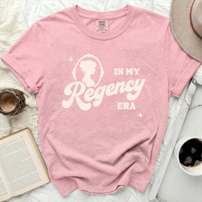 Pink t-shirt with "In My Regency Era" graphic and cameo silhouette.