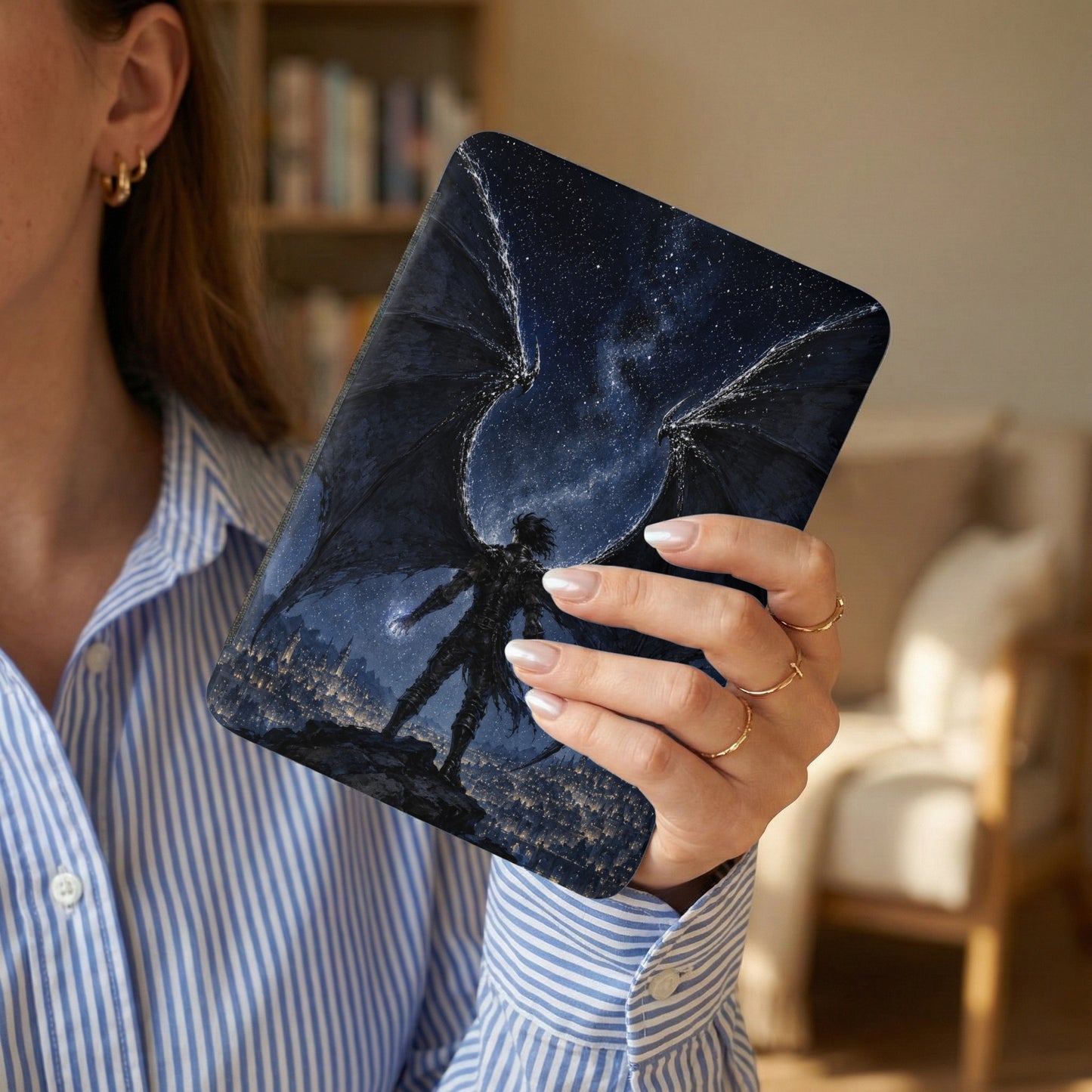 E-reader cover with dark angel against a starry sky and city.