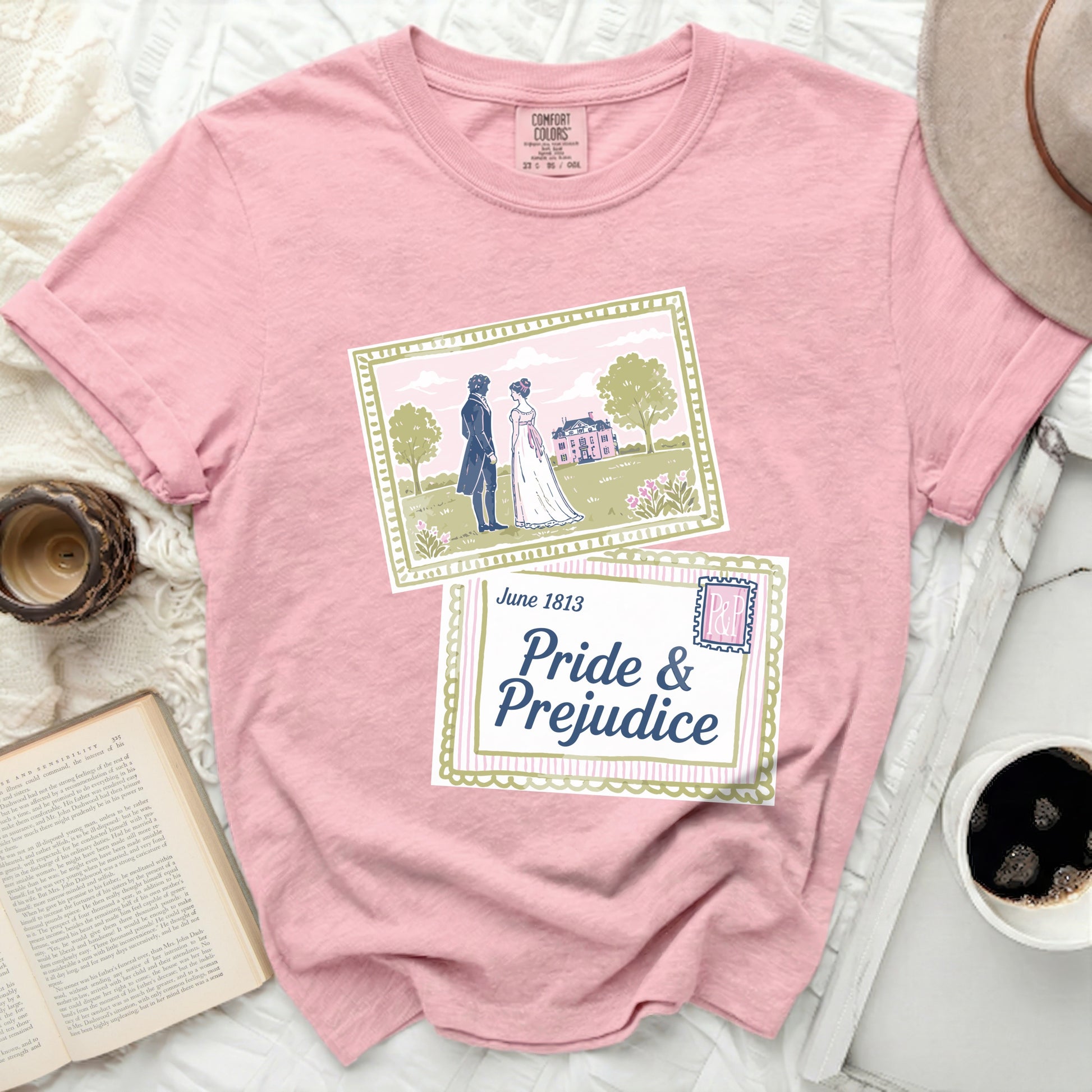 Pink shirt with "Pride & Prejudice" and scene art.