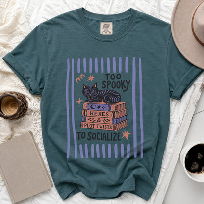 Teal t-shirt with a black cat on books and "Too Spooky to Socialize" text.