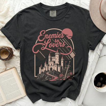 Black Comfort Colors t-shirt with "Enemies to Lovers" castle graphic.