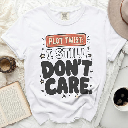 White t-shirt with "Plot Twist: I Still Don't Care" text and stars.
