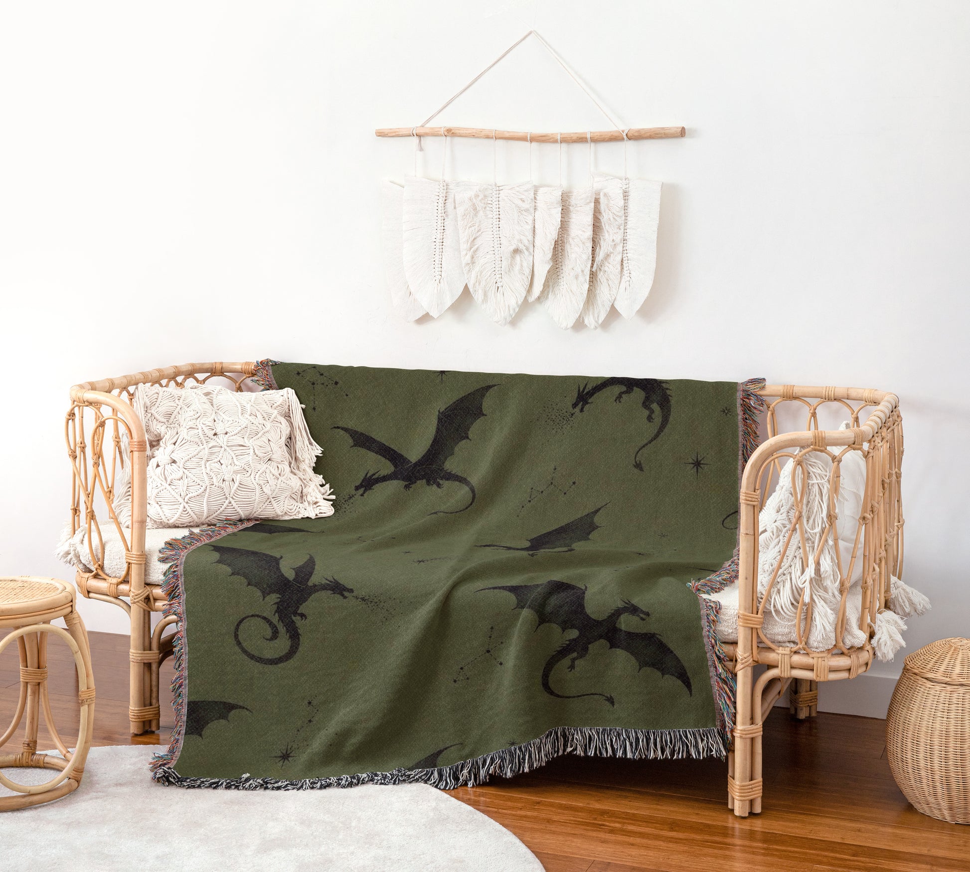 a cozy living space with a green dragon-themed throw blanket draped over a wicker bench. The bench is accompanied by a small side table and a woven basket, creating a comfortable and inviting atmosphere.