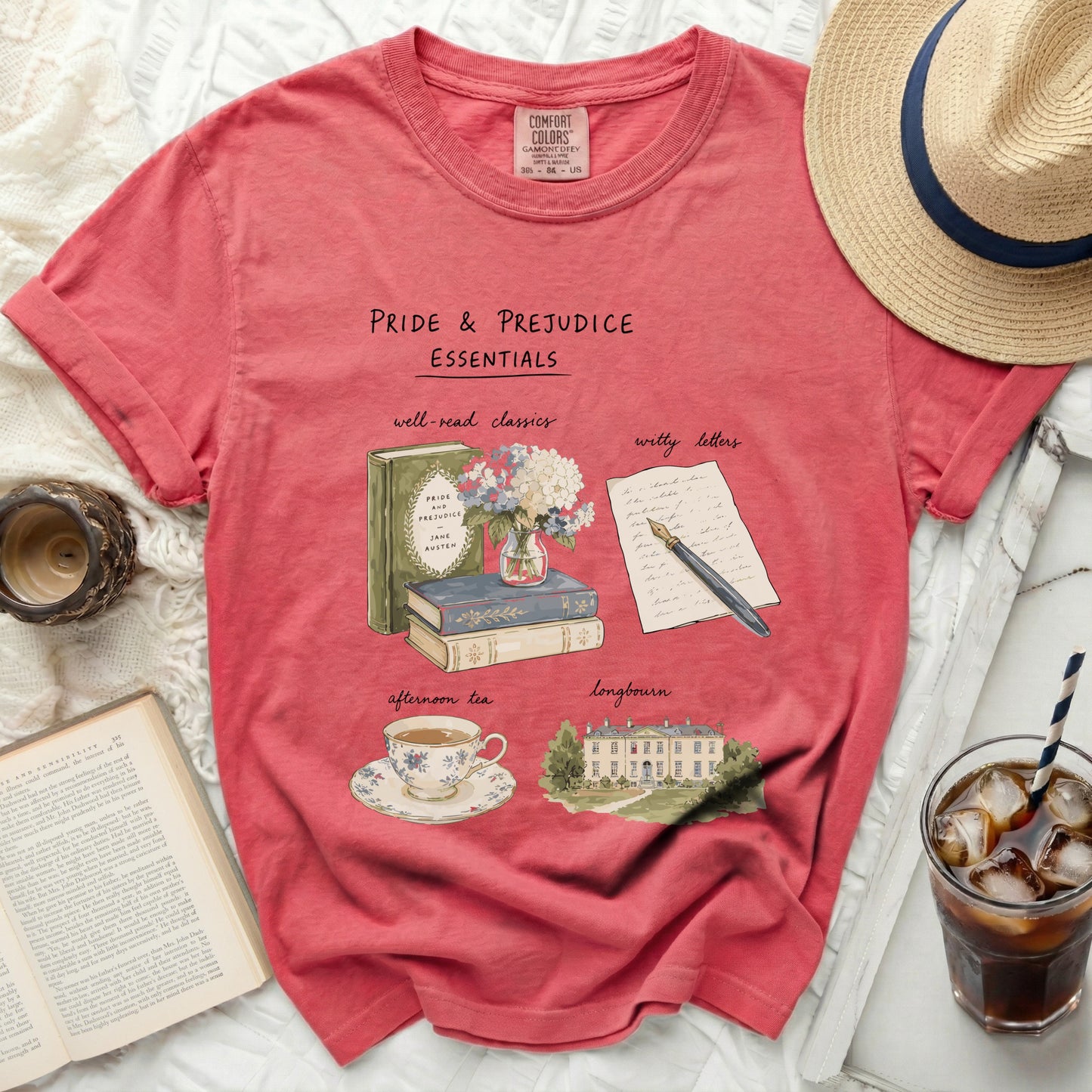 Pink t-shirt with "Pride & Prejudice Essentials" graphic.