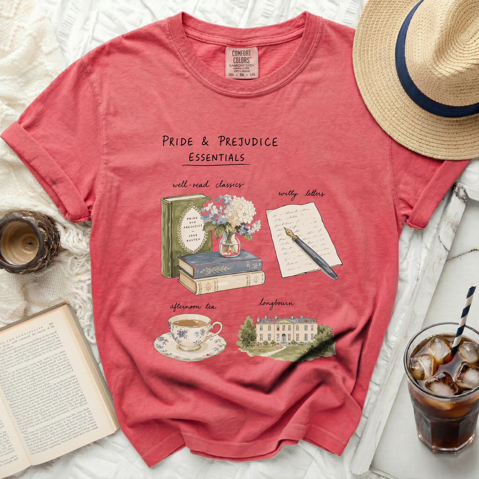 Pink t-shirt with "Pride & Prejudice Essentials" graphic.