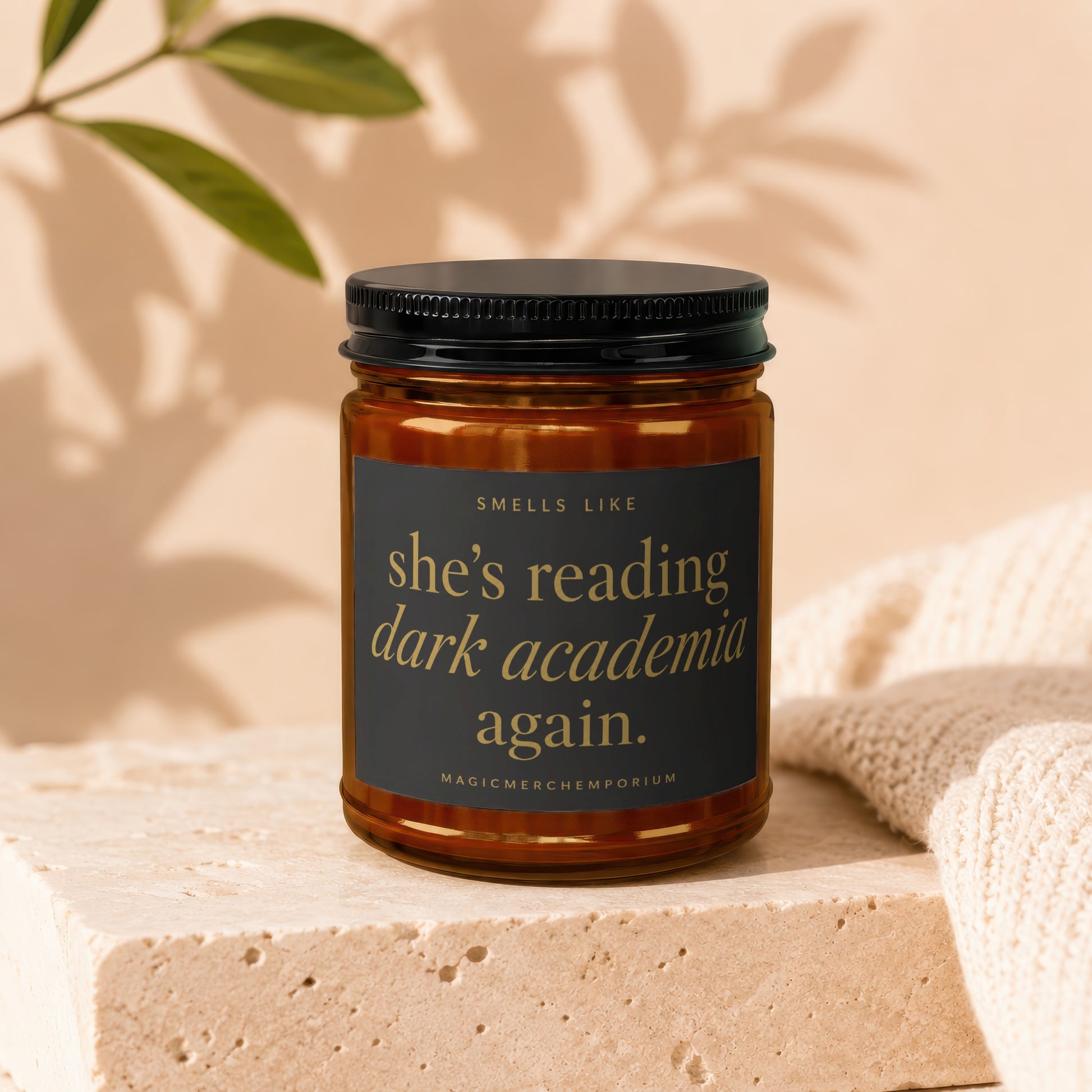 Candle with text "Smells Like She's Reading Dark Academia Again."