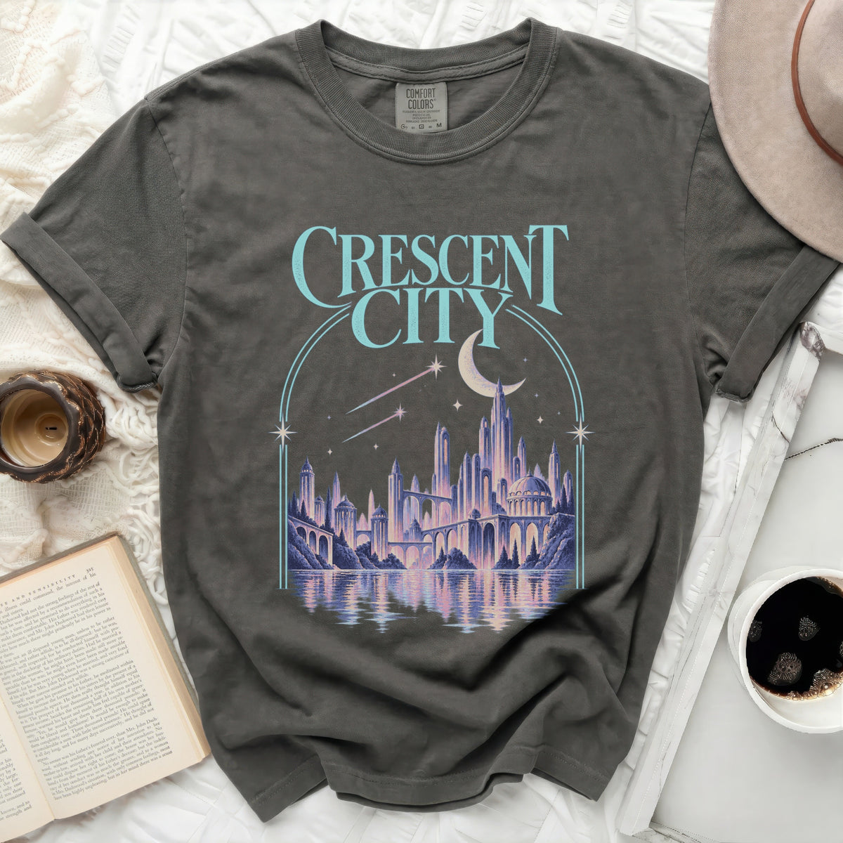Dark t-shirt with "Crescent City" text and a fantasy city graphic.