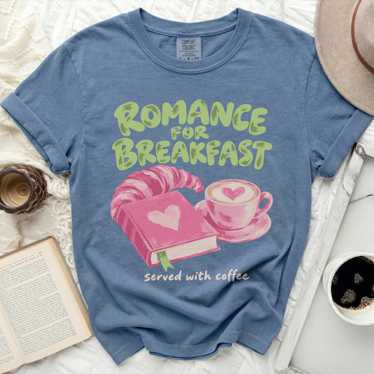 Blue t-shirt with "Romance for Breakfast served with coffee" and heart graphics.