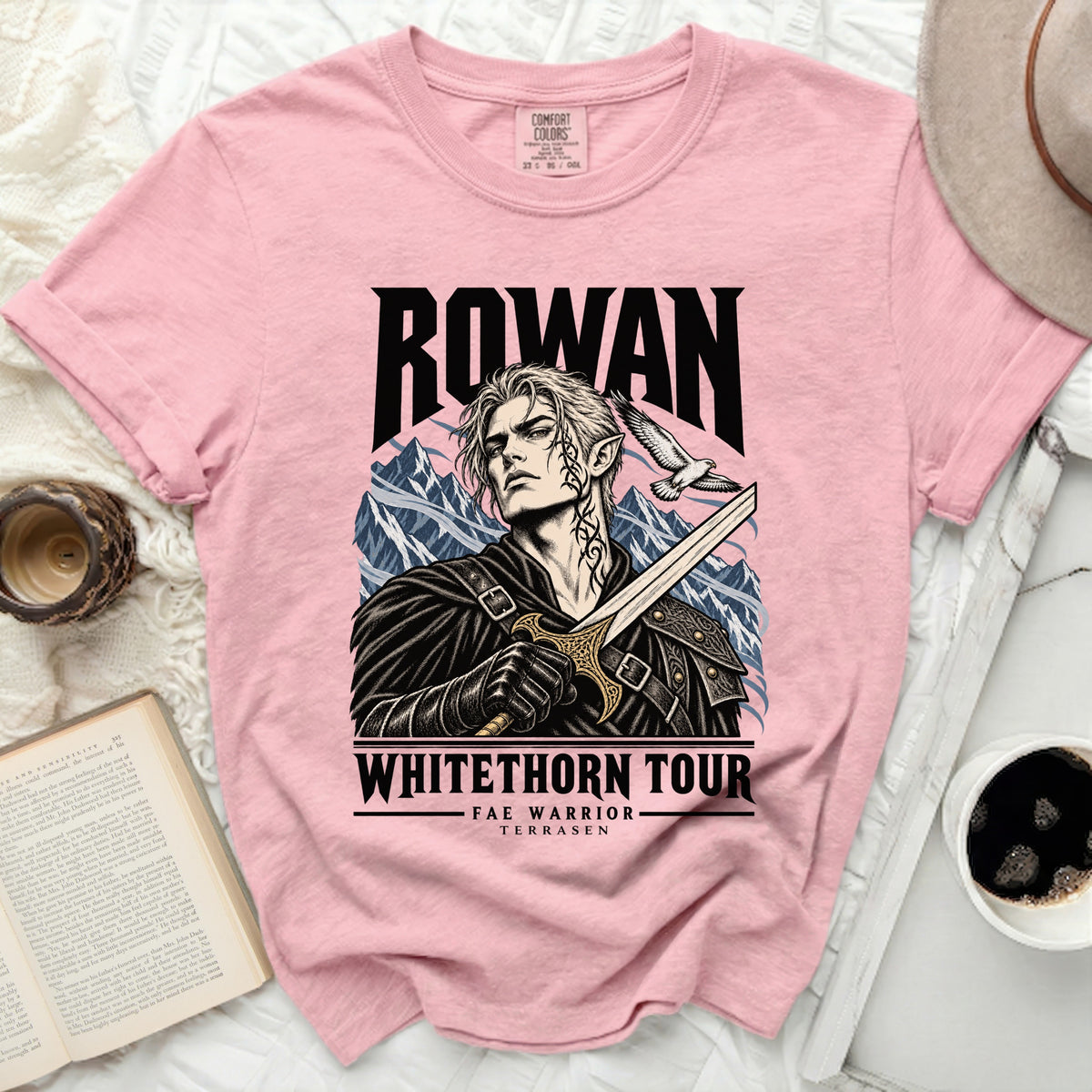 Pink t-shirt featuring Rowan, Fae Warrior, Terrasen graphic with sword and bird.