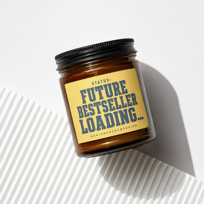 Amber jar candle with yellow label: "STATUS: FUTURE BESTSELLER LOADING..."