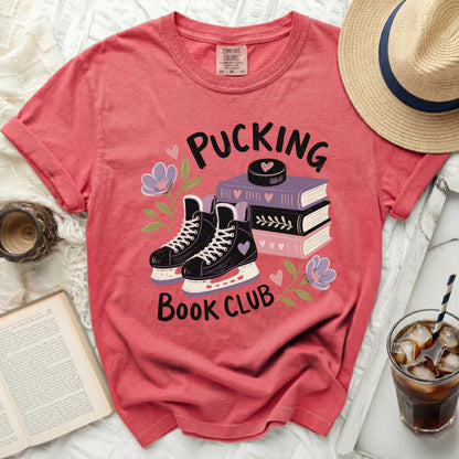 T-shirt with "Pucking Book Club" text and hockey skates.