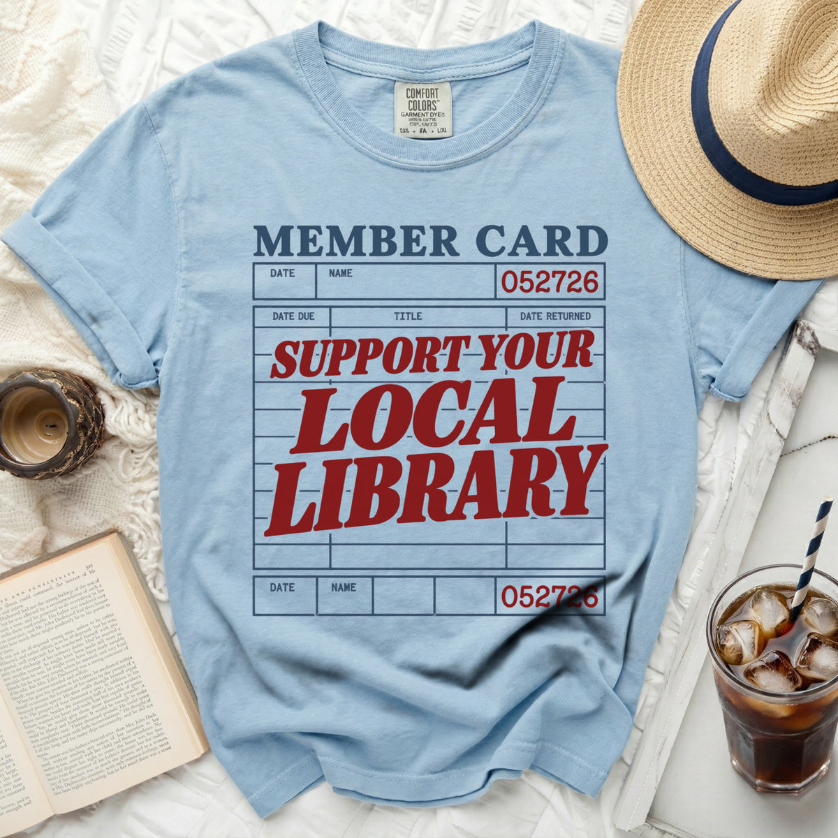 Light blue t-shirt with "MEMBER CARD" and "SUPPORT-YOUR-LOCAL LIBRARY" text.