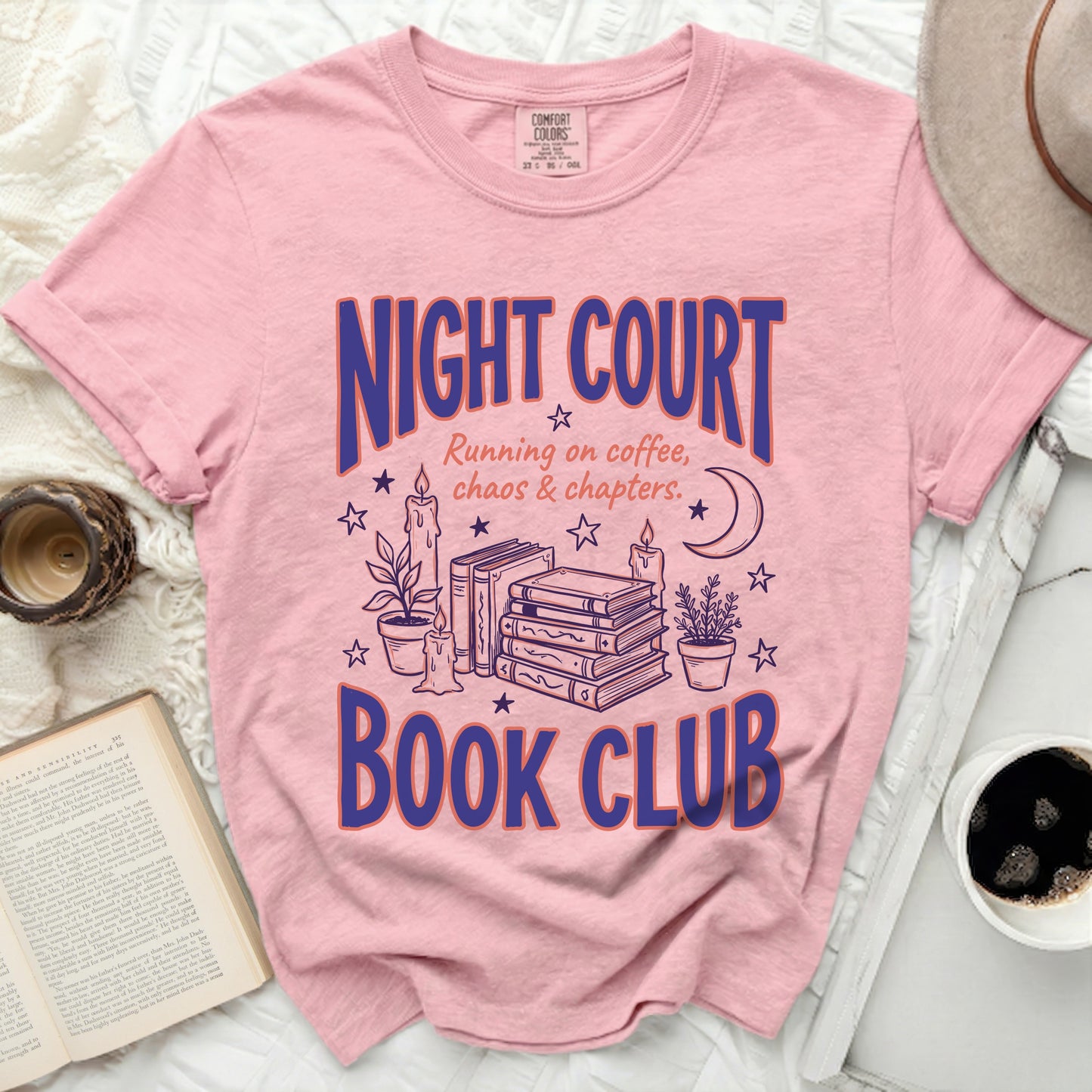 Pink t-shirt with "Night Court Book Club" graphic and book illustrations.
