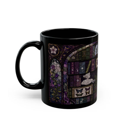 Black mug with stained glass design of books, flowers, and butterflies.