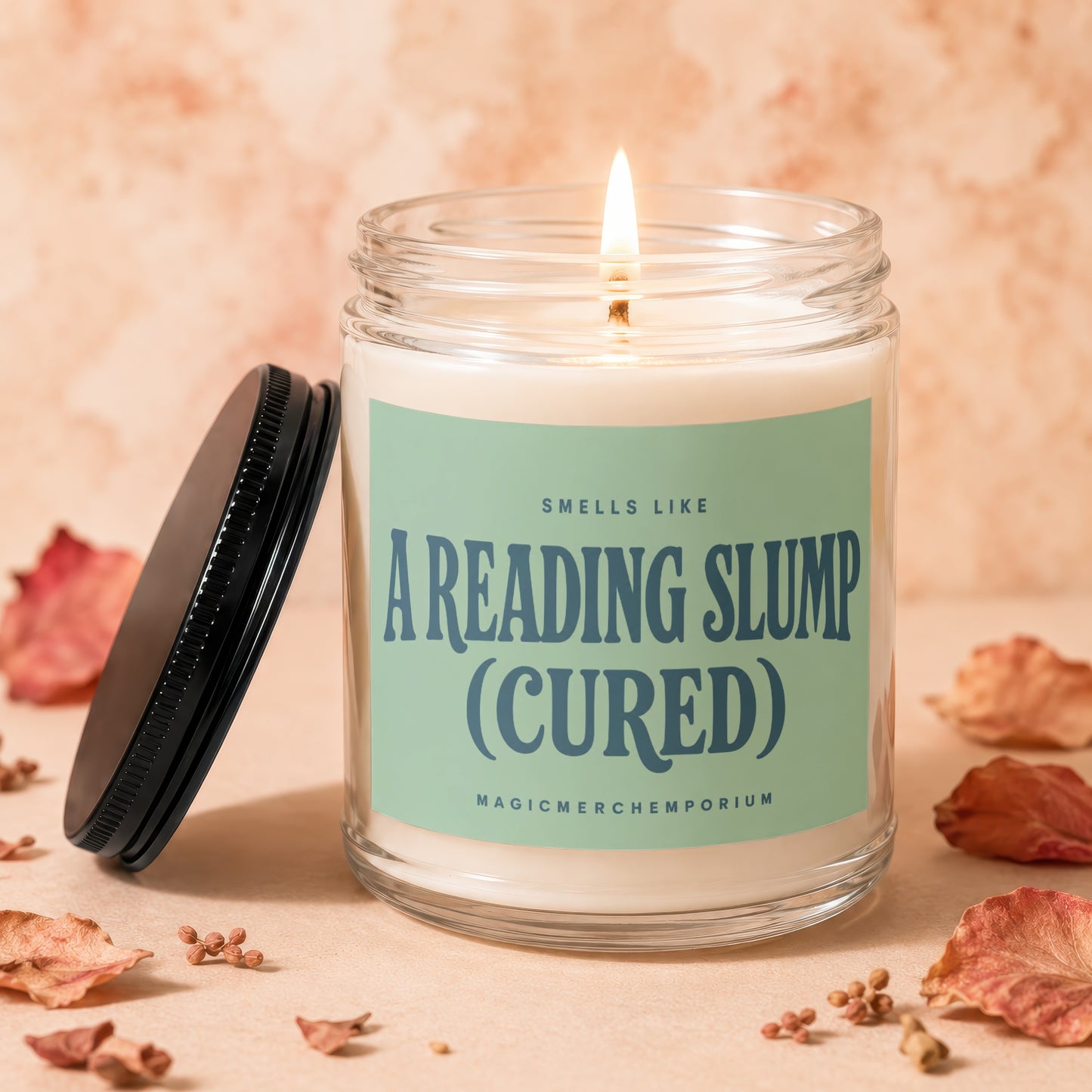 Candle with "A Reading Slump (Cured)" label and lit wick.