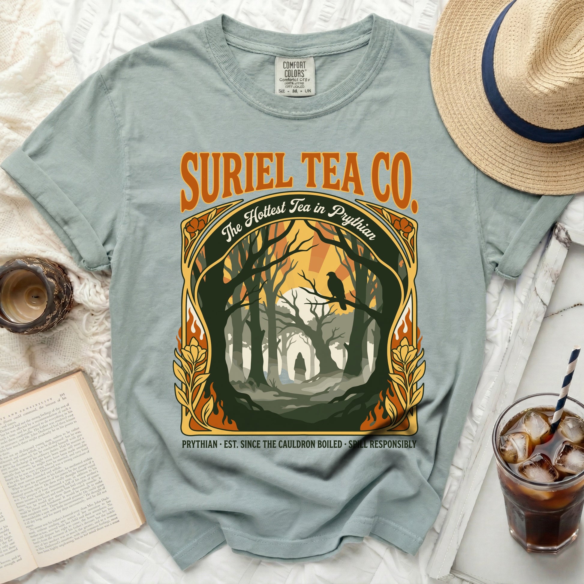 Suriel Tea Co. graphic tee featuring a mystical forest scene and the text "The Hottest Tea in Prythian."