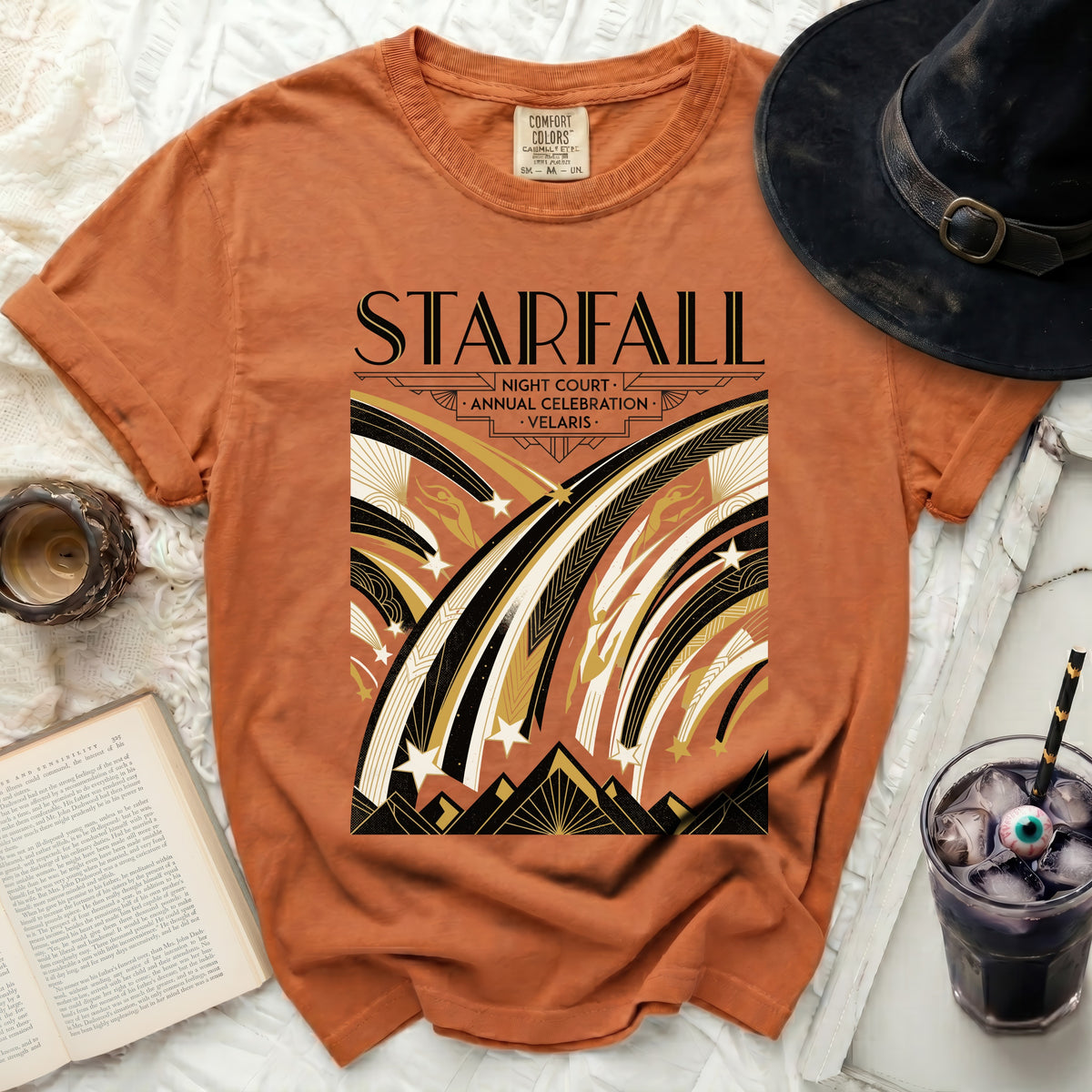 Orange t-shirt with "Starfall Night Court Annual Celebration Velaris" text and falling stars design.