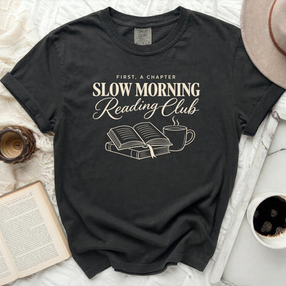 Comfort Colors t-shirt with "First, A Chapter Slow Morning Reading Club" graphic.