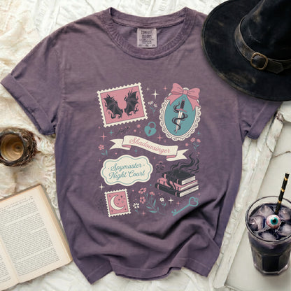 Purple t-shirt with "Shadowsinger Spymaster Night Court" graphic.