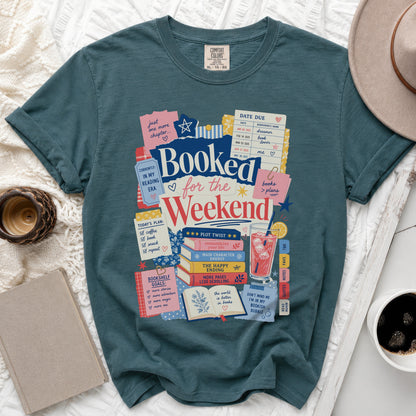 Teal t-shirt with "Booked for the Weekend" graphic and book-themed text.