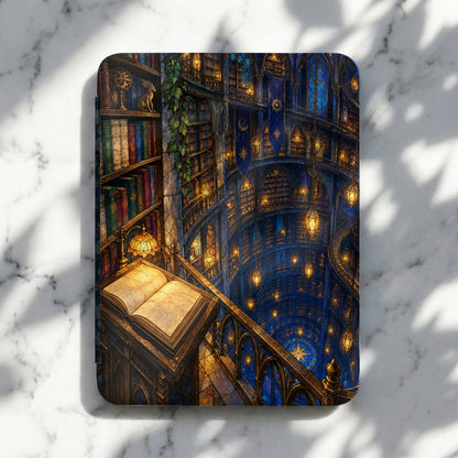 Open book rests on a railing in a grand, circular library with stained glass windows.