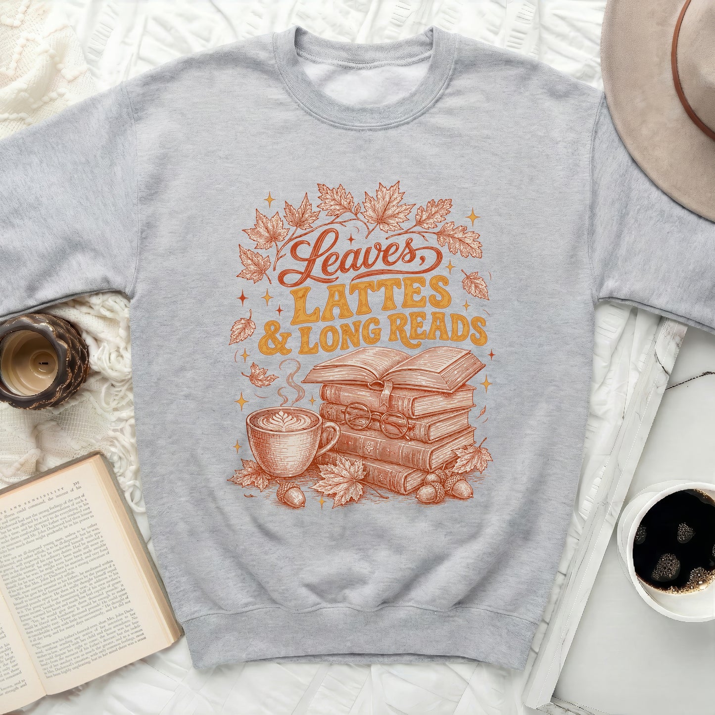 Gray sweatshirt with "Leaves, Lattes & Long Reads" graphic.