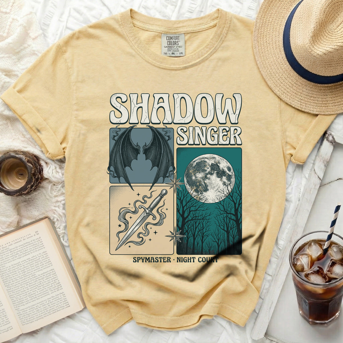 Yellow t-shirt with "Shadow Singer Spymaster Night Court" graphic.