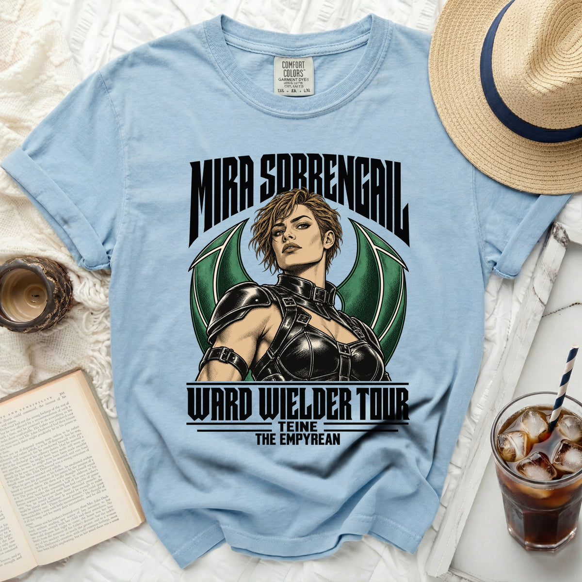 Light blue t-shirt with graphic of Mira Sorrenaga for Ward Wielder Tour.