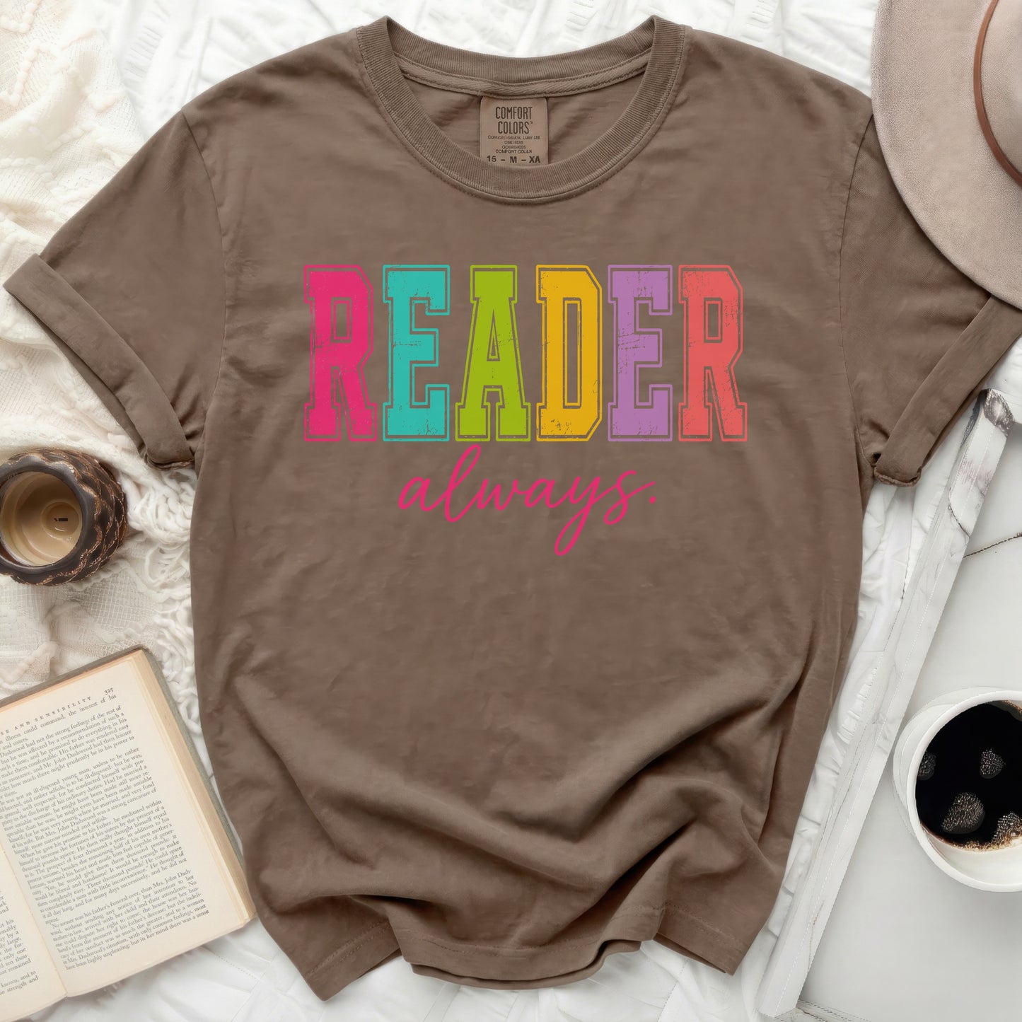 Brown t-shirt with "READER always" in colorful block letters.