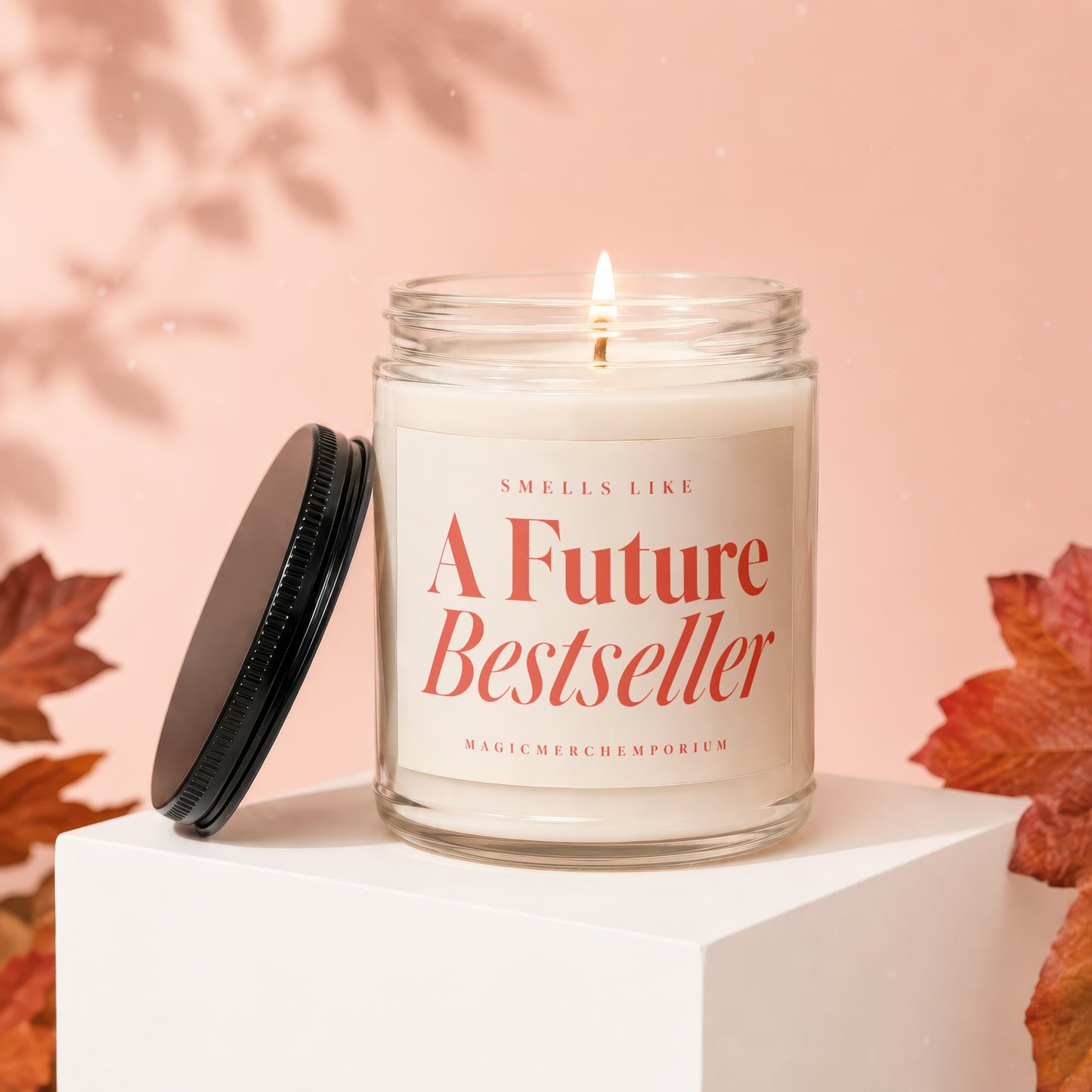 Jar candle with lit wick, "Smells Like A Future Bestseller" text.