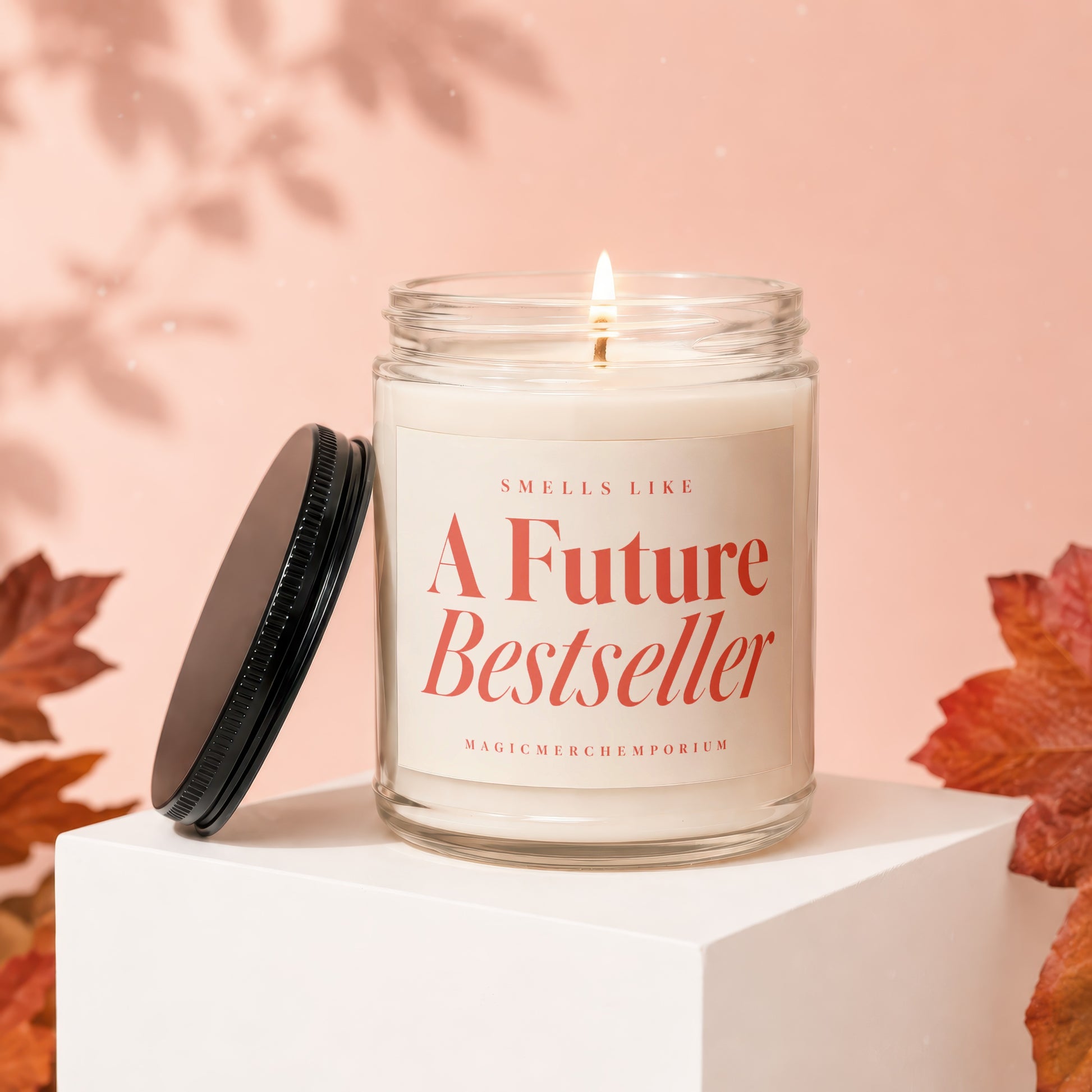 Jar candle with lit wick, "Smells Like A Future Bestseller" text.