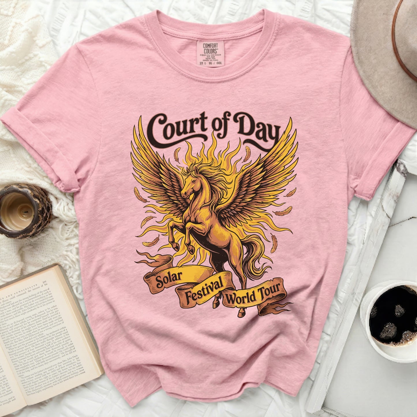 Pink t-shirt with gold Pegasus graphic and "Court of Day Solar Festival World Tour" text.