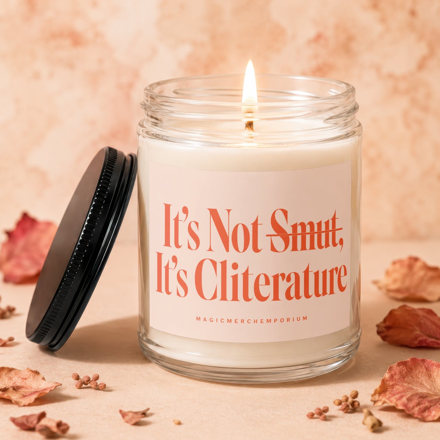 Candle with text "It's Not Smut, It's Cliterature" and "MagicMerchEmporium".