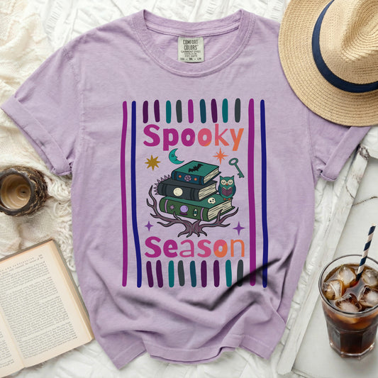 Purple shirt with "Spooky Season" graphic and Halloween icons.