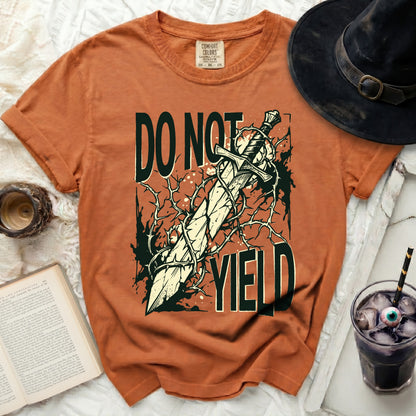 Orange t-shirt with "DO NOT YIELD" and a sword graphic.