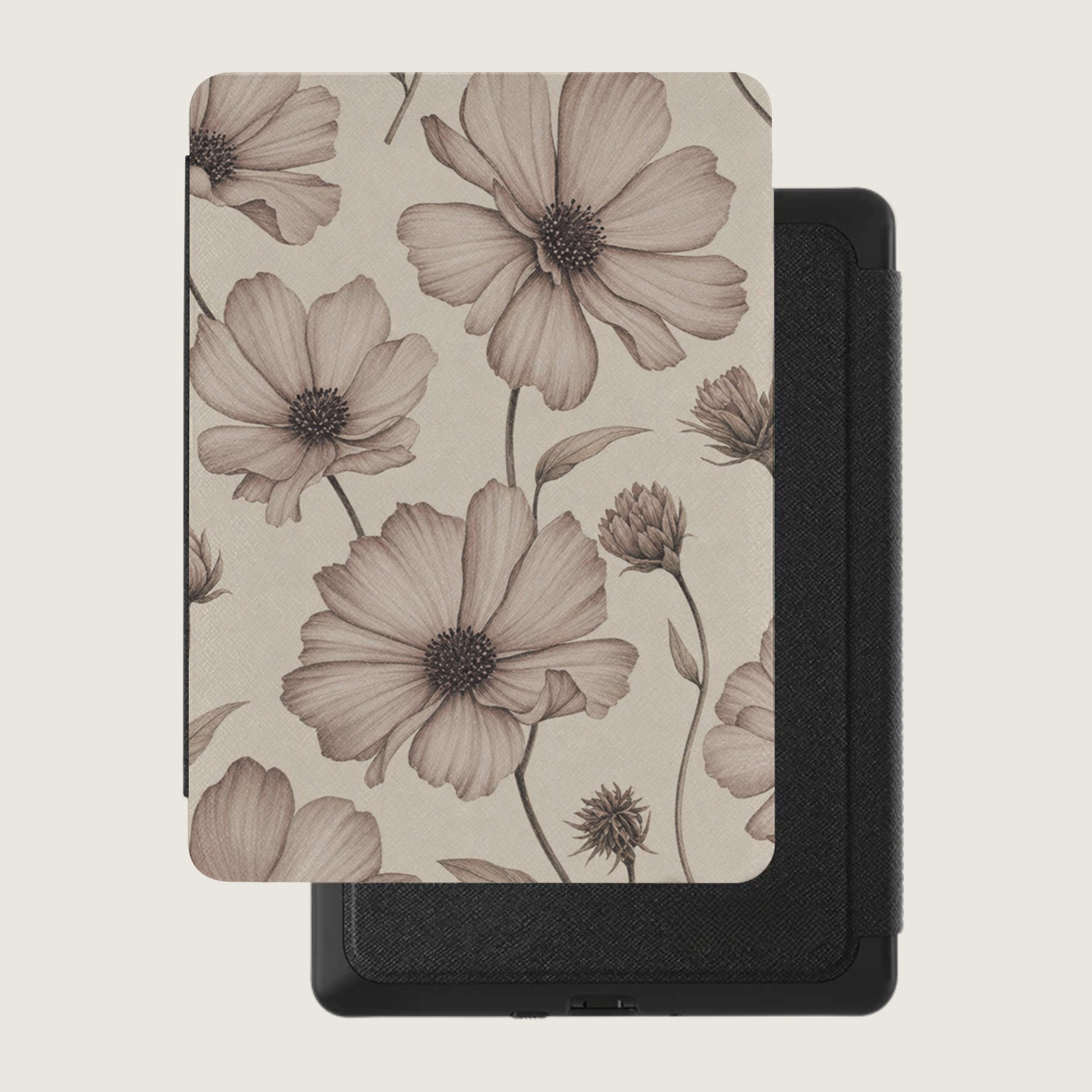 E-reader cover with sepia-toned floral pattern over black textured case.