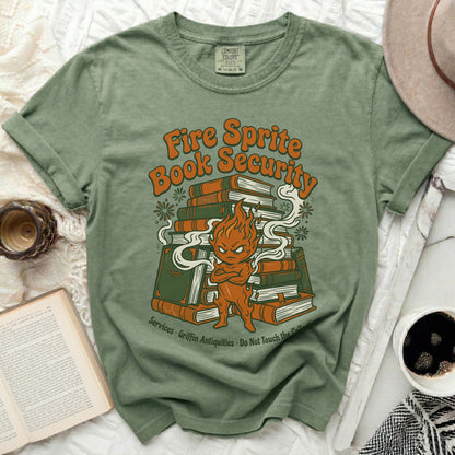 Green t-shirt with "Fire Sprite Book Security" graphic and cartoon character.