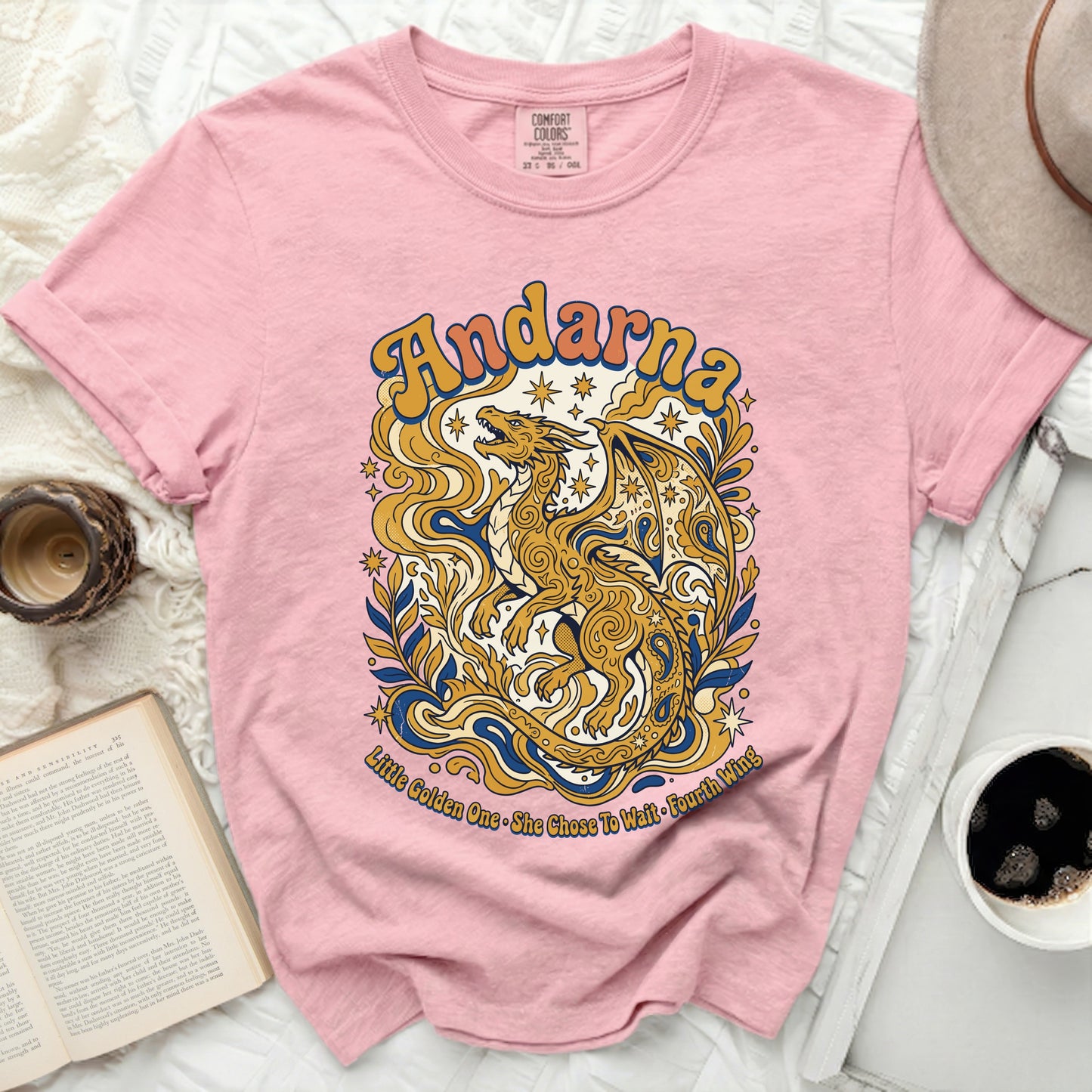 Pink t-shirt with gold dragon and "Andarna" text.