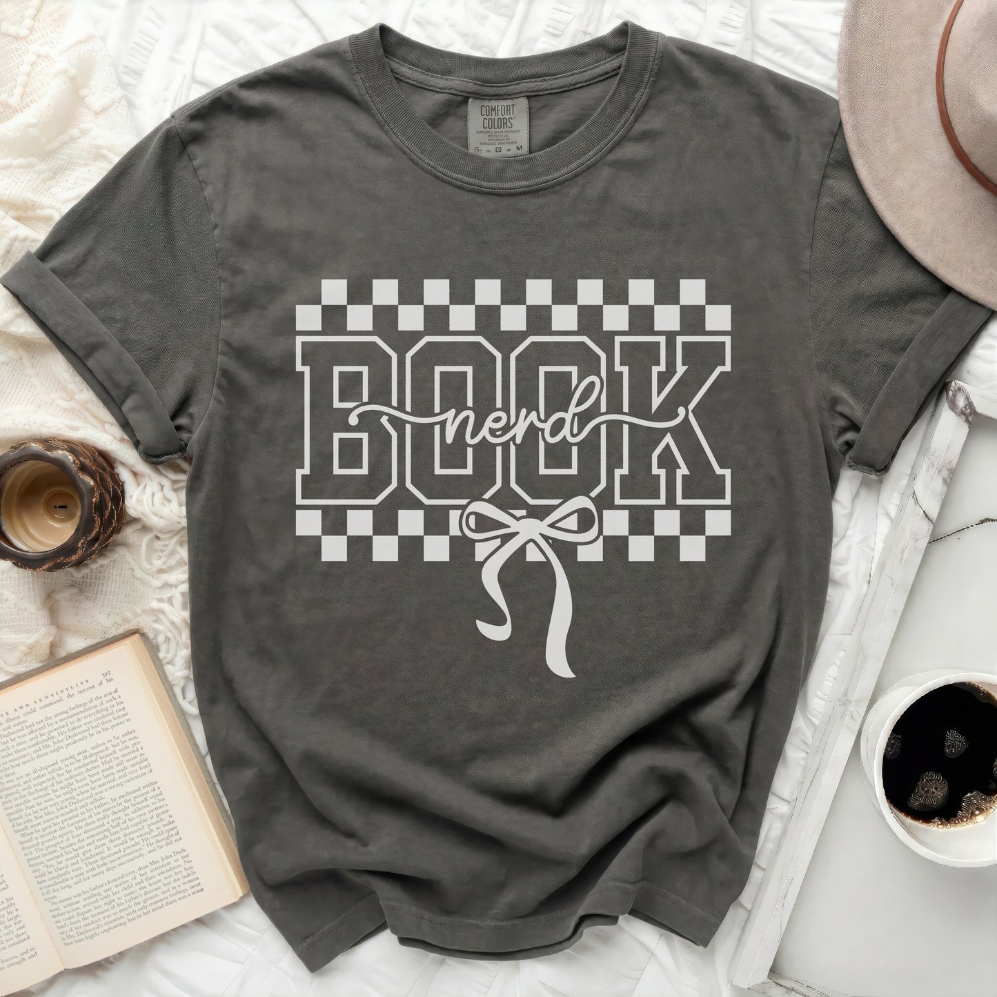 Dark gray t-shirt with "BOOK nerd" graphic and bow.