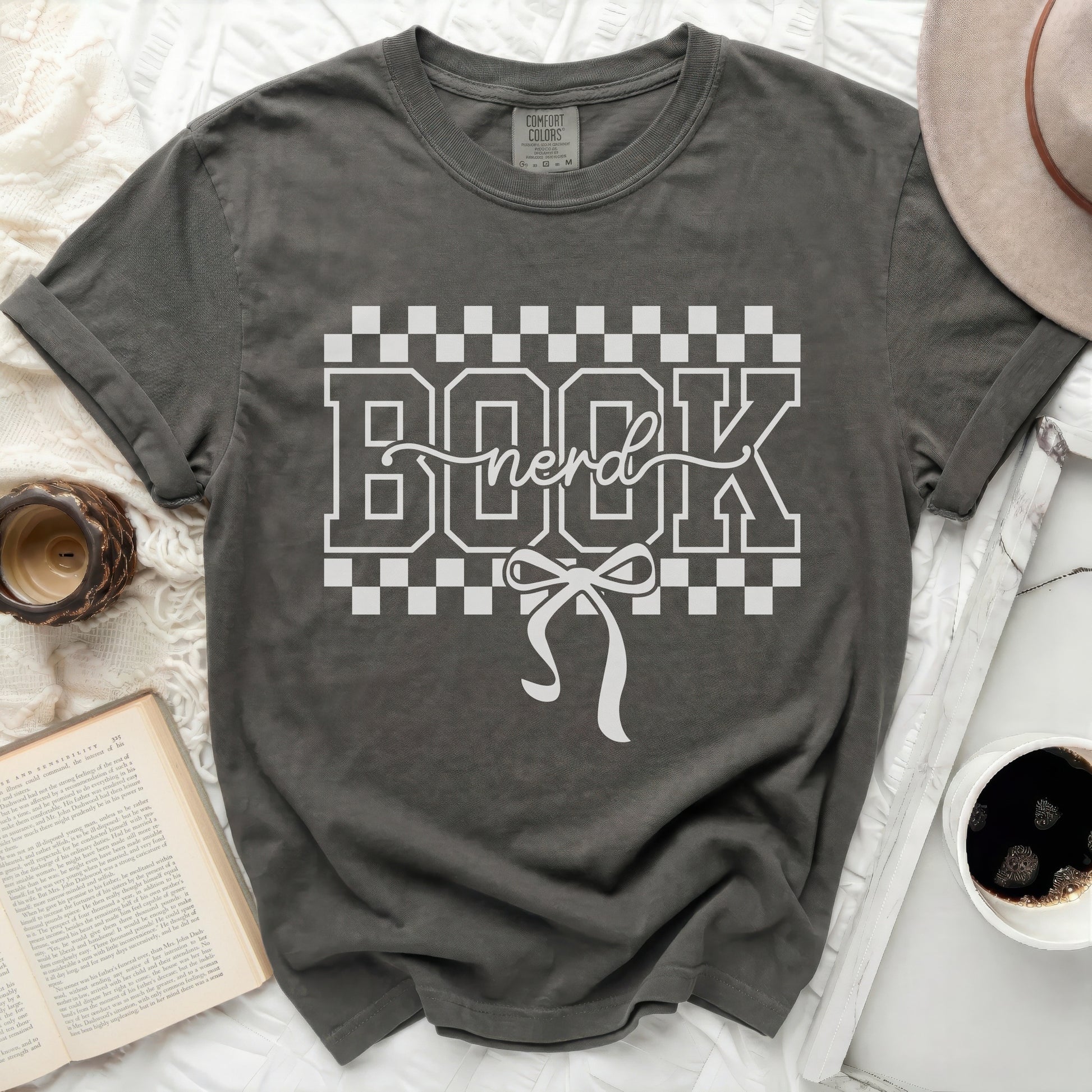 Dark gray t-shirt with "BOOK nerd" graphic and bow.